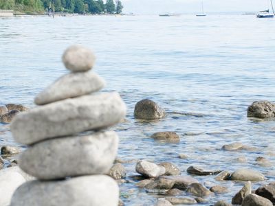 Stack of perfectly balanced stones by the water.